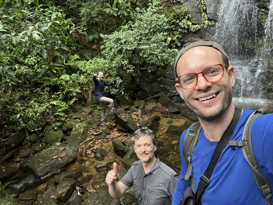 Mathias Madsen Munch, Anders Hentze and Ronni Kot Wenzell by a waterfall